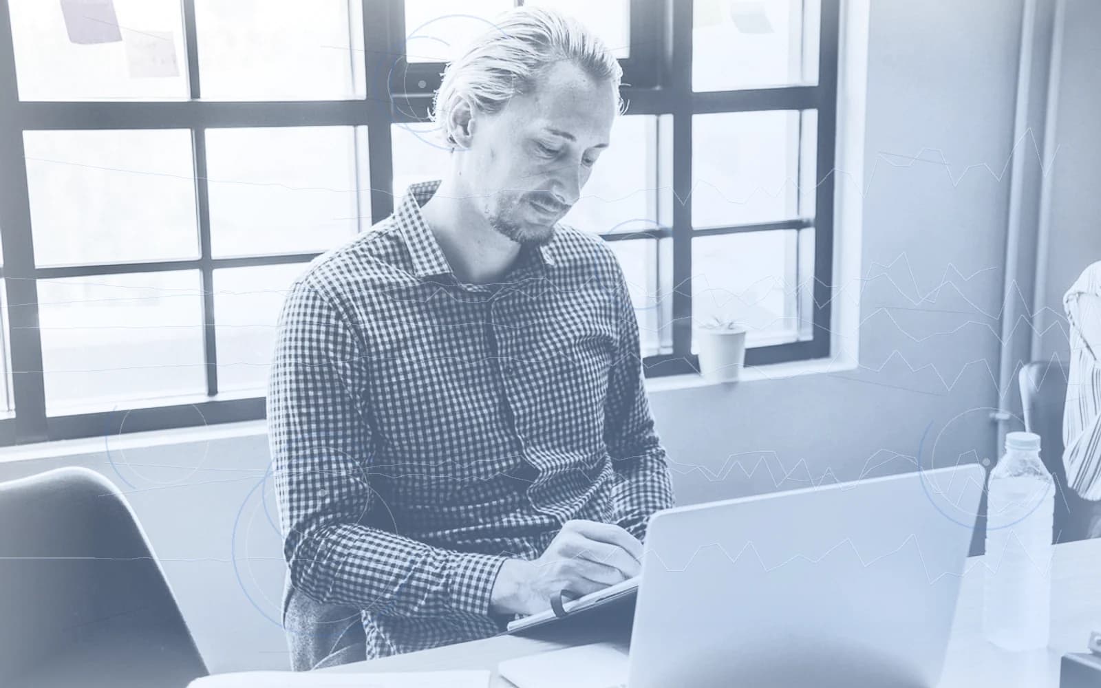 Editorial image for "The Three Conversations Every Founder Should Have Before a Liquidity Event". Source image: Businessman noting down.