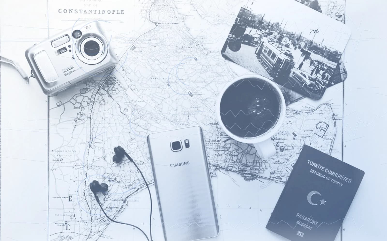 Editorial image for "The Wealth Nomad's First Principle: Your Life Is Global, But Your Advice Is Usually Local". Source image: silver-camera-near-black-coffee-in-mug-silver-samsung-galaxy-2305761.